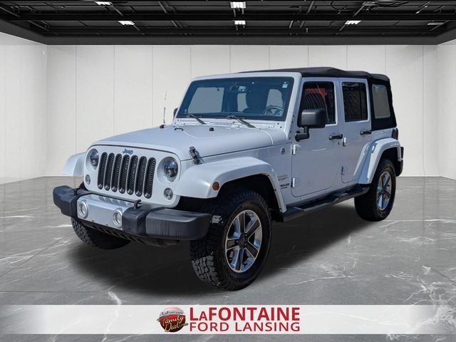 2014 Jeep Wrangler Unlimited Sahara in Bright White Clearcoat — front three-quarter view