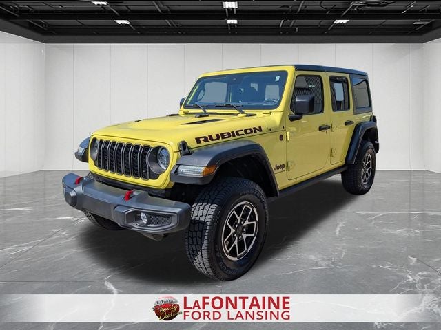 2024 Jeep Wrangler Rubicon in High Velocity Clearcoat — front three-quarter view