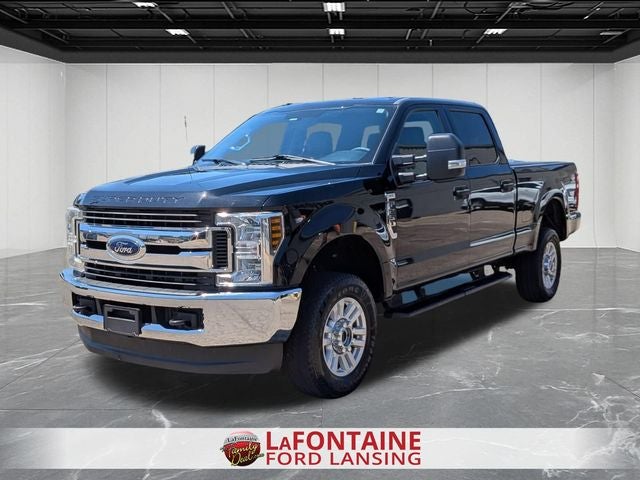 2019 Ford F-250SD XLT in Agate Black Metallic — front three-quarter view