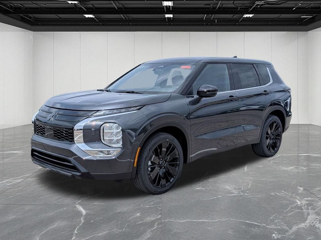 2026 Mitsubishi Outlander LE in Graphite Gray — front three-quarter view