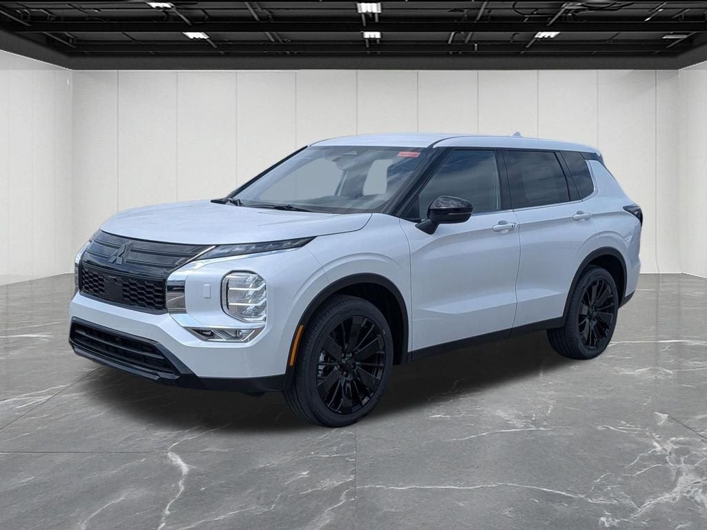 2026 Mitsubishi Outlander LE in Diamond White — front three-quarter view