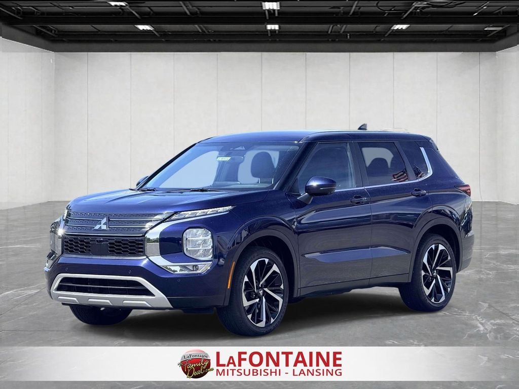 2024 Mitsubishi Outlander SE in Cosmic Blue Metallic — front three-quarter view